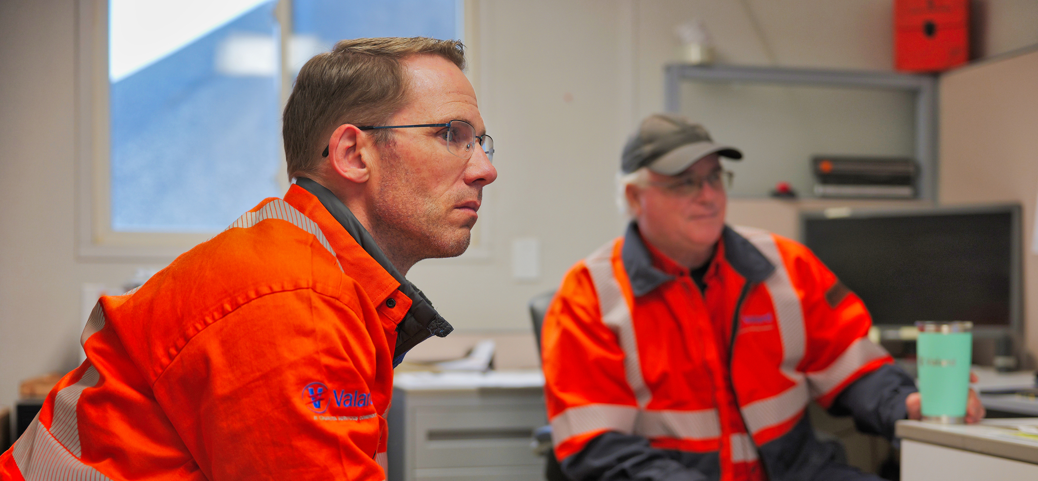 2 men in an office planning their day